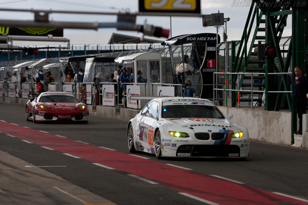 BMW and Ferrari on pit road - Chassis: 1001  - 2010 Le Mans Series Silverstone 1000 km (ILMC)